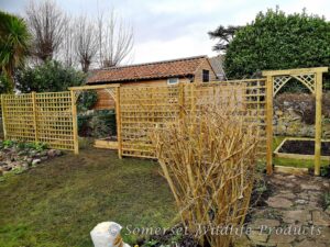Trellis divide with archways into new vegetable garden. Yatton, North Somerset